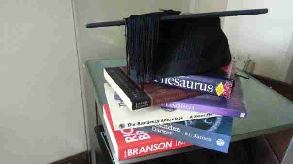 Image of books and graduation hat